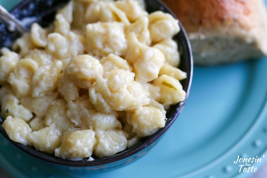 A close up of a bowl of white cheddar mac n cheese