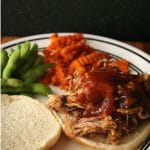 Beef or pork slow cooked in Dr. Pepper is perfectly tender and deliciously topped with a homemade BBQ sauce.