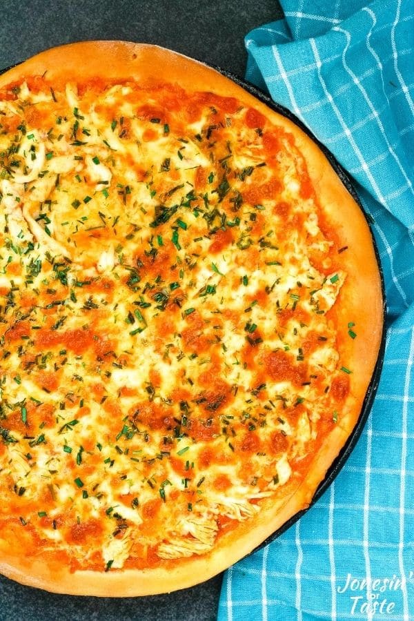 Buffalo chicken pizza on a cookie sheet