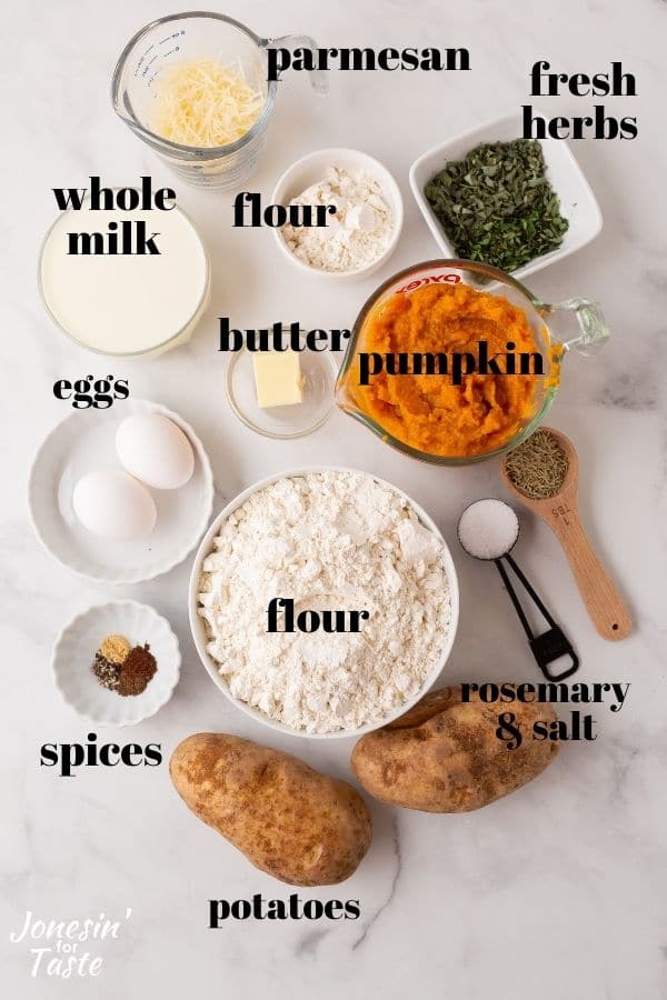 ingredients laid out on a white background. Some are in bowls or measuring spoons and some are whole