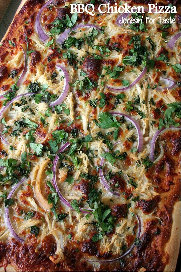 a bbq chicken pizza topped with cilantro and sliced red onions