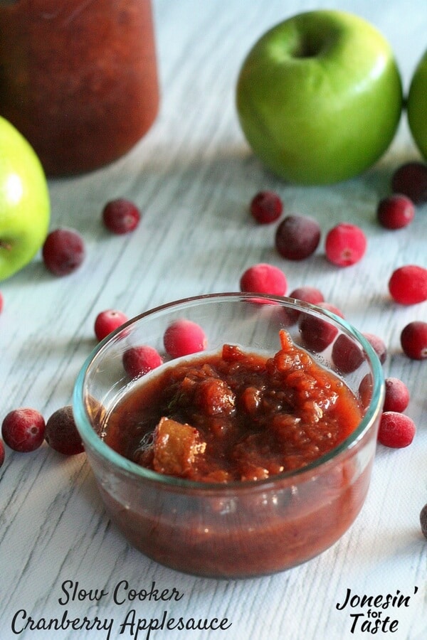 Slow Cooker Cranberry Applesauce is a perfect overnight slow cooker recipe. We love it over oatmeal, pancakes, and waffles- it's a great alternative to syrup!