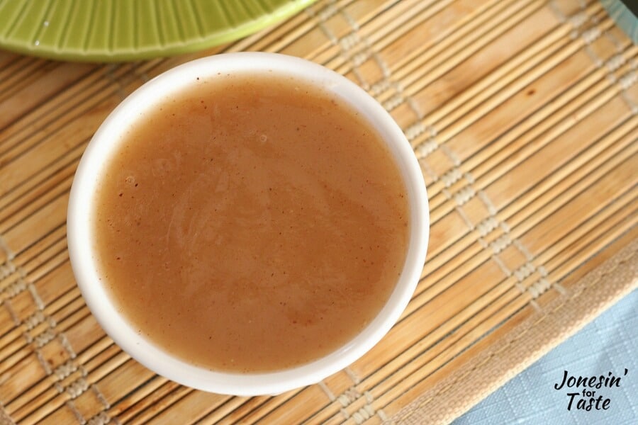 A small bowl of apple syrup.