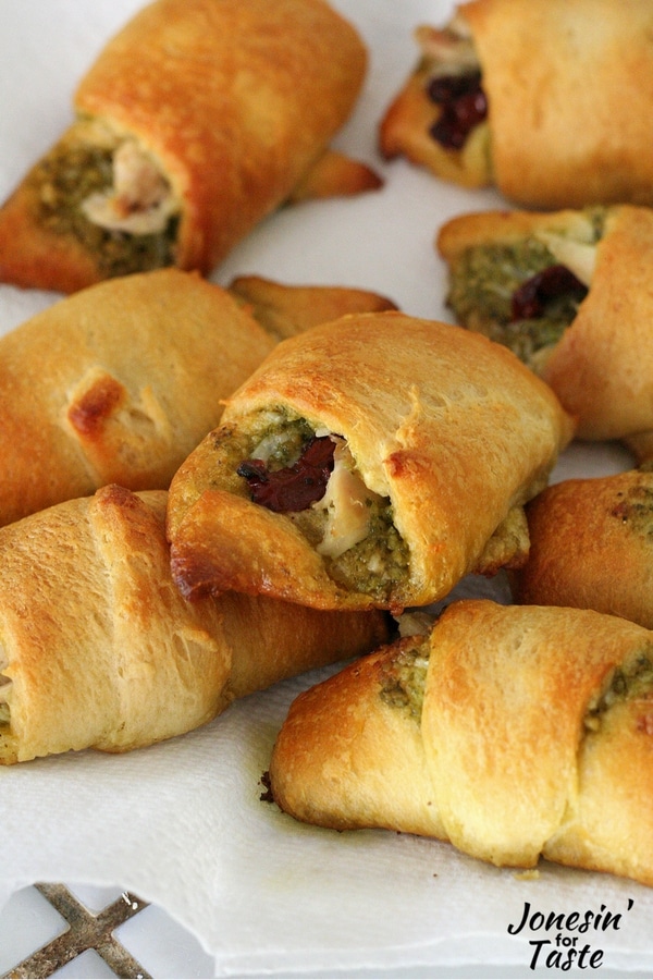 A pile of chicken croissants with pesto and sun dried tomato
