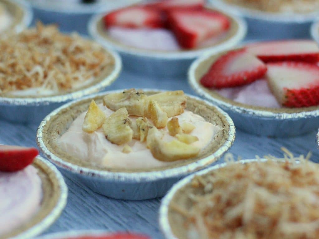 A no bake banana cheesecake among strawberry and coconut no bake cheesecakes.