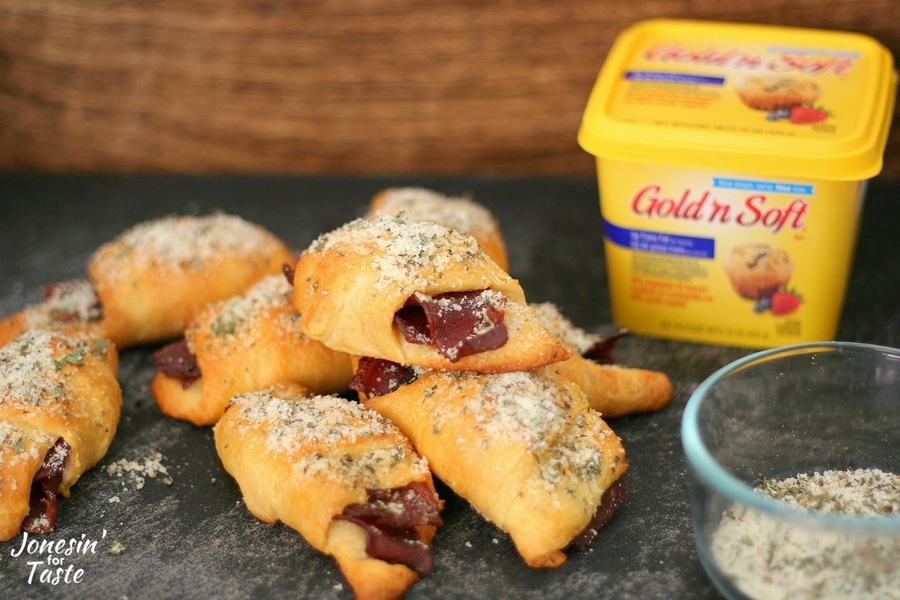 A pile of easy bacon croissants on a cutting board