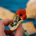 Easy Mini Spinach Calzones is a tasty appetizer with a creamy Parmesan spinach filling that is a crowd pleaser for game day.