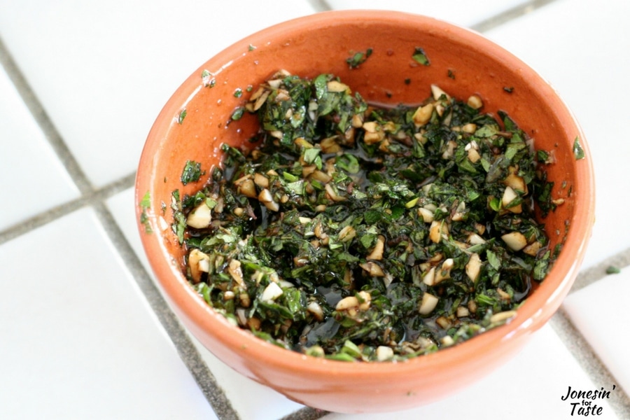 Chopped oregano leaves, garlic, and balsamic vinegar in a bowl for Slow Cooker Garlic Balsamic Pork.