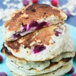 A stack of Oatmeal Cranberry Pancakes on a light blue plate.