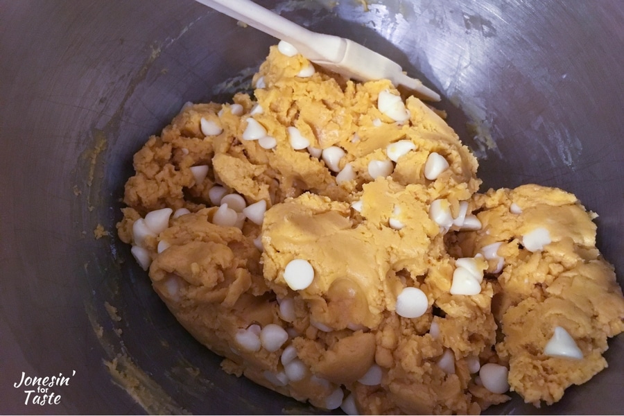 White Chocolate Peanut Butter Cookie Bars dough in a mixer.