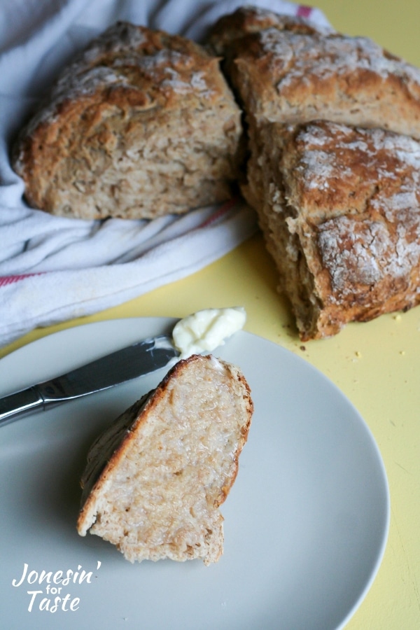 A knife with butter and a slice of soda bread