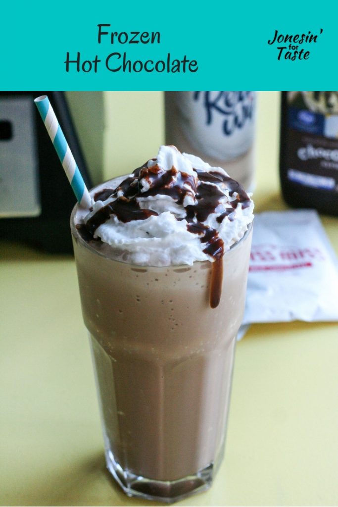 A cup of frozen chocolate in front of the ingredients you need to make it