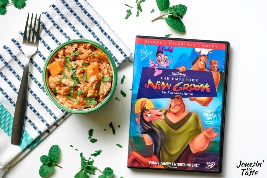 Green bowl of chicken and rice with a DVD