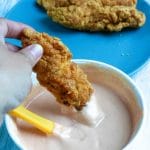 dipping chicken in fry sauce