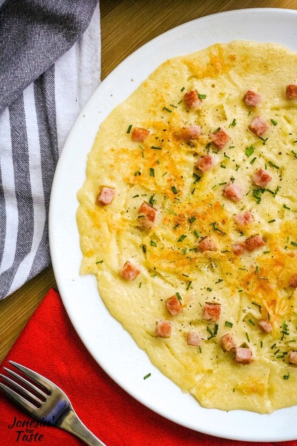 a savory pannenkoek with ham, cheese, and chives