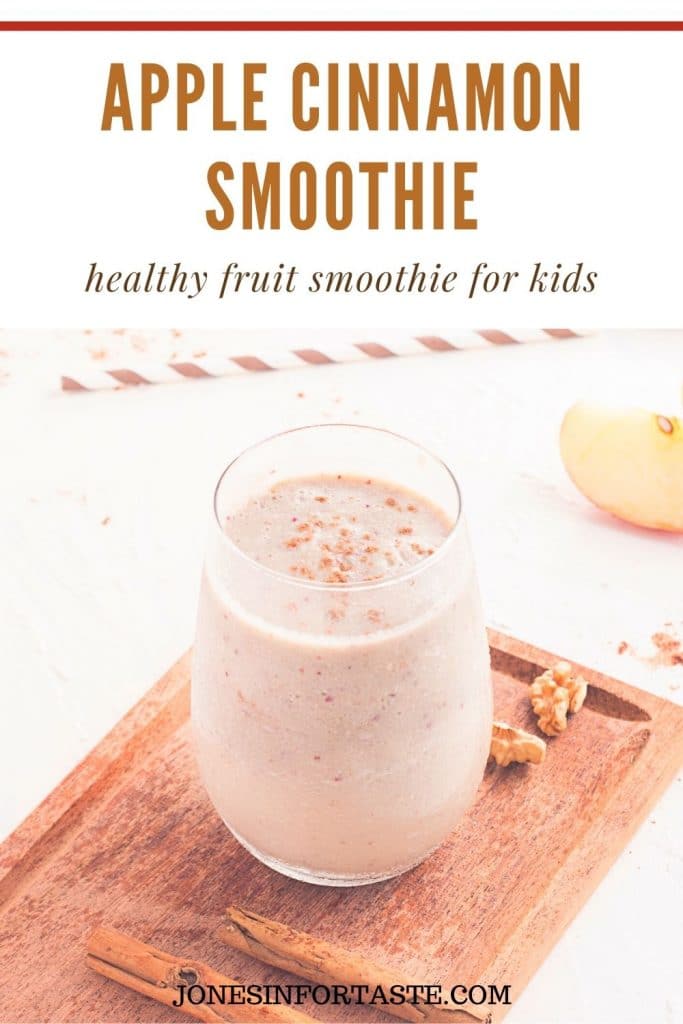 a text and photo collage. Text at the top says apple cinnamon smoothie, healthy fruit smoothie for kids. The photo below is of a glass of apple cinnamon smoothie on a wooden cutting board