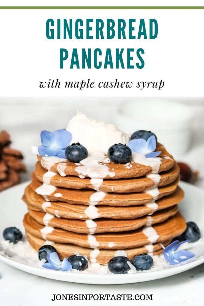 a stack of gingerbread pancakes with syrup drizzling down the sides