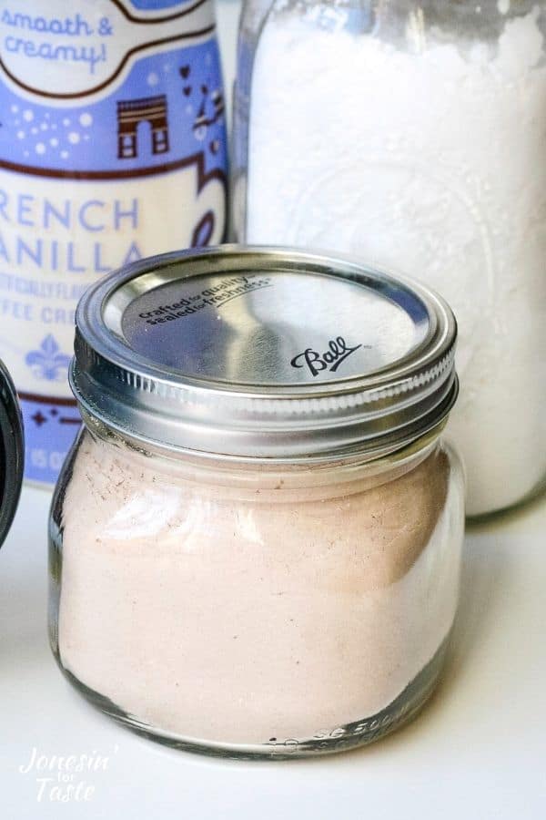 a small mason jar filled with hot cocoa mix