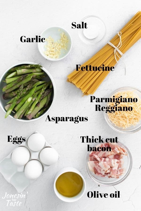 roasted asparagus carbonara ingredients on a white background