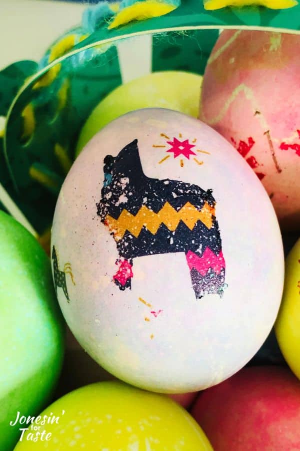 a pink Easter egg with a headless llama tattoo on the egg